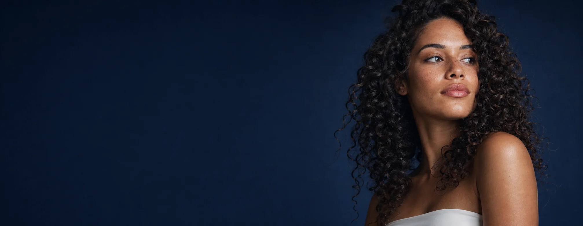 Woman with defined natural curls